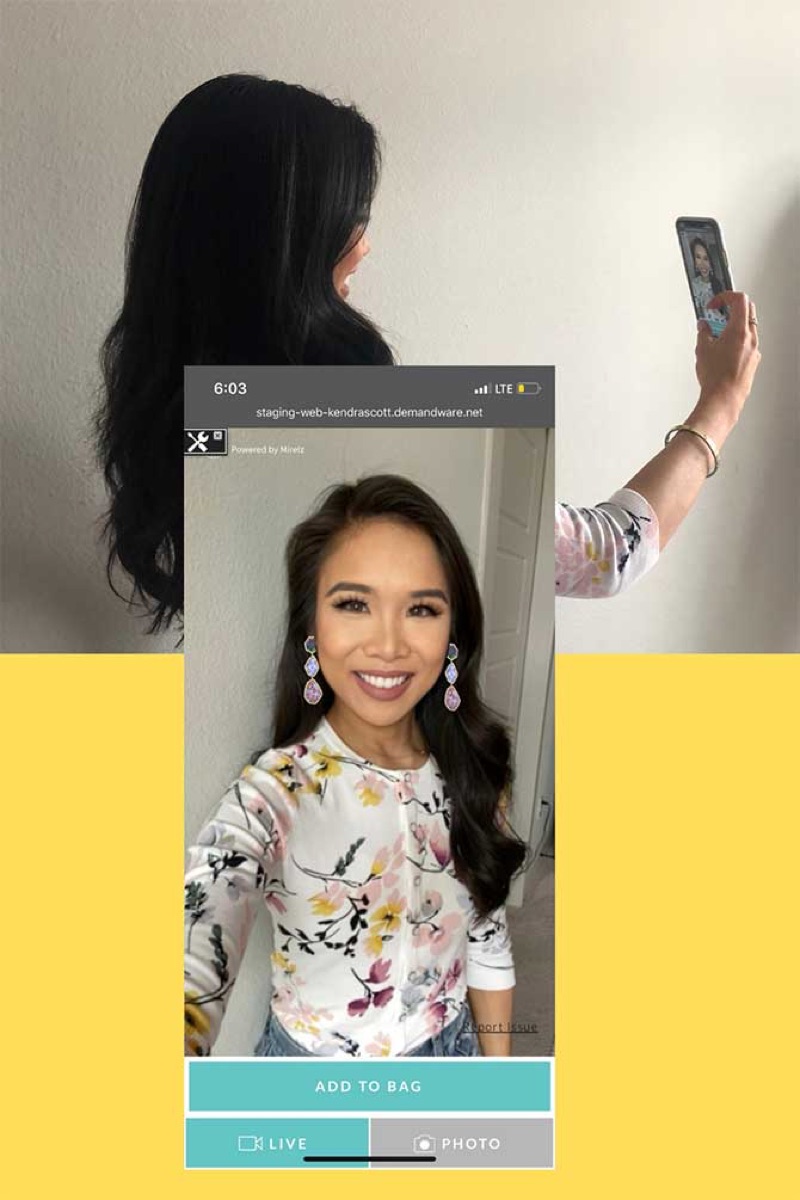 A female blogger tries on a pair of earrings virtually.