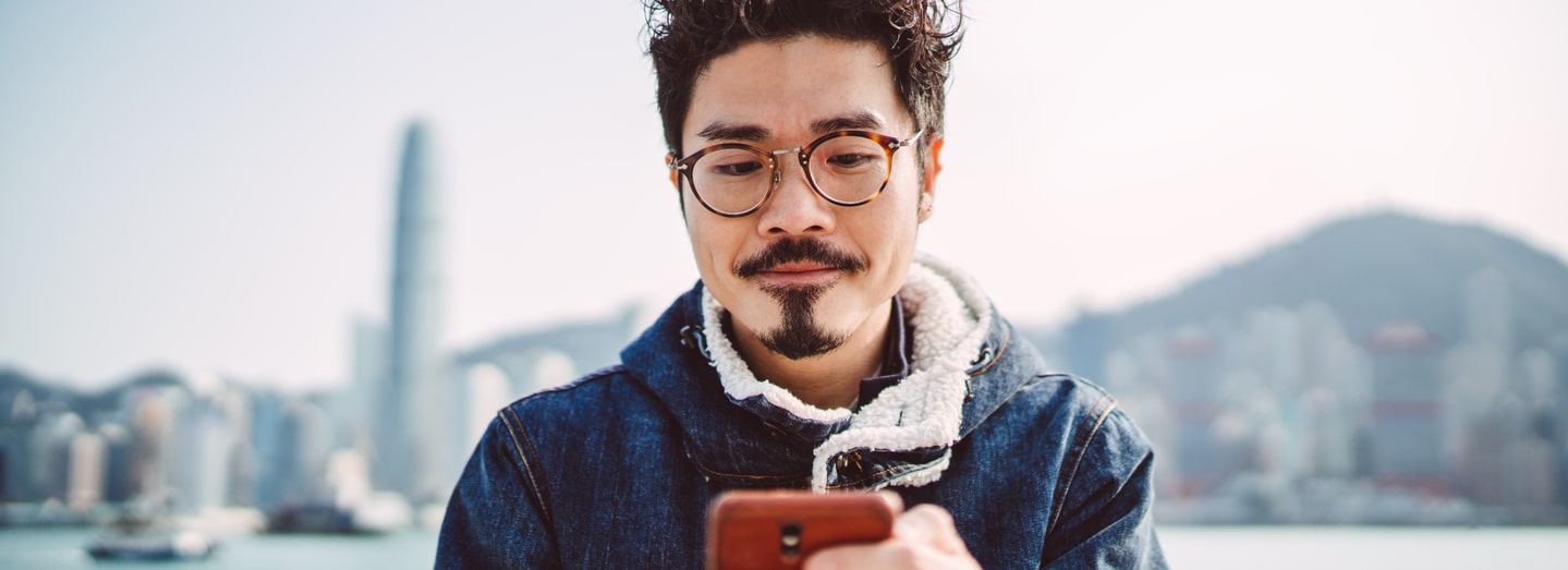 A man reads on his smartphone.