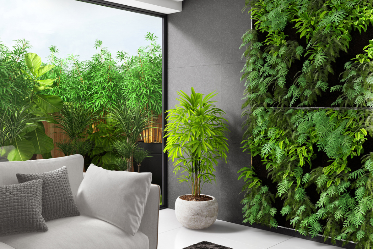 A living room with an indoor garden wall. 