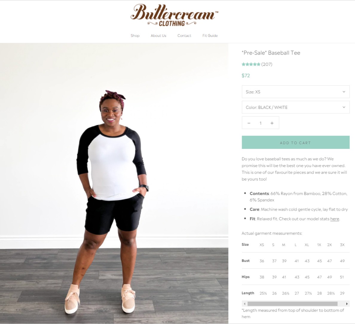 A model wears a black and white baseball tee on a Buttercream Clothing product page.