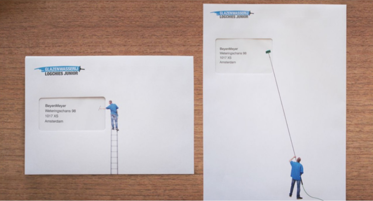Two envelopes from Logchies Junior’s direct mail campaign both feature a window cleaner in a blue shirt cleaning the window pain of the envelope. A small envelope features the man on a ladder, a larger envelope features the man using an extended tool.