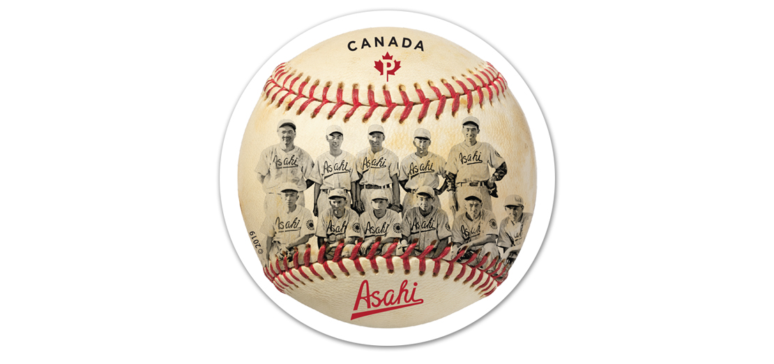 Baseball with red stitching printed with photo of 11 members of Vancouver Asahi team 