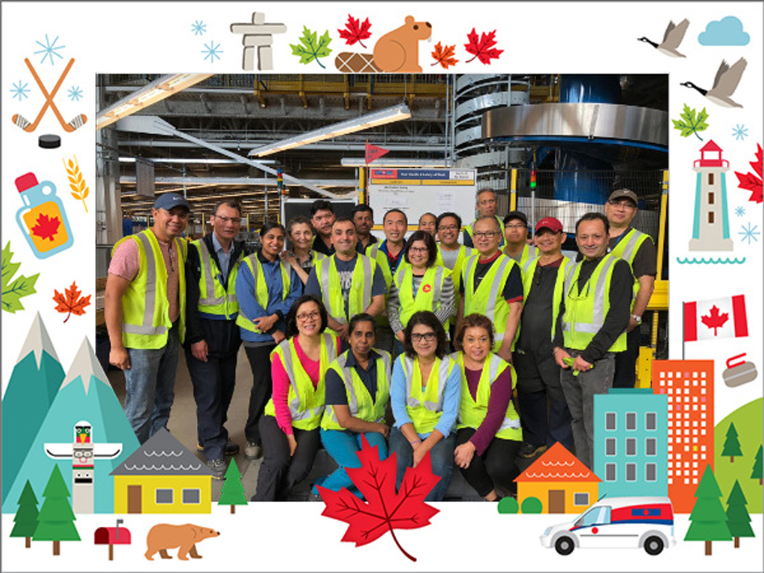 Canada Post employees pose for a group photo