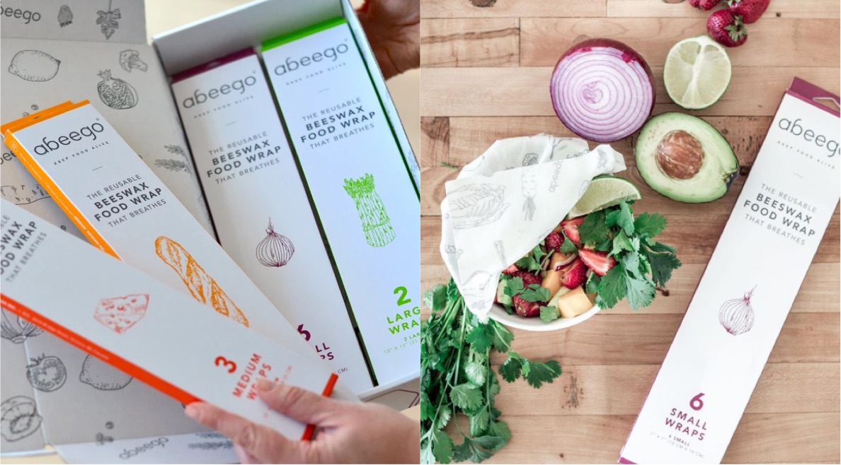 A woman unboxes an assortment of Abeego wraps. A salad is partially covered by an Abeego wrap on a cutting board.