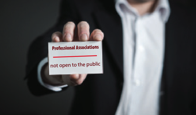 A person holding their professional association card