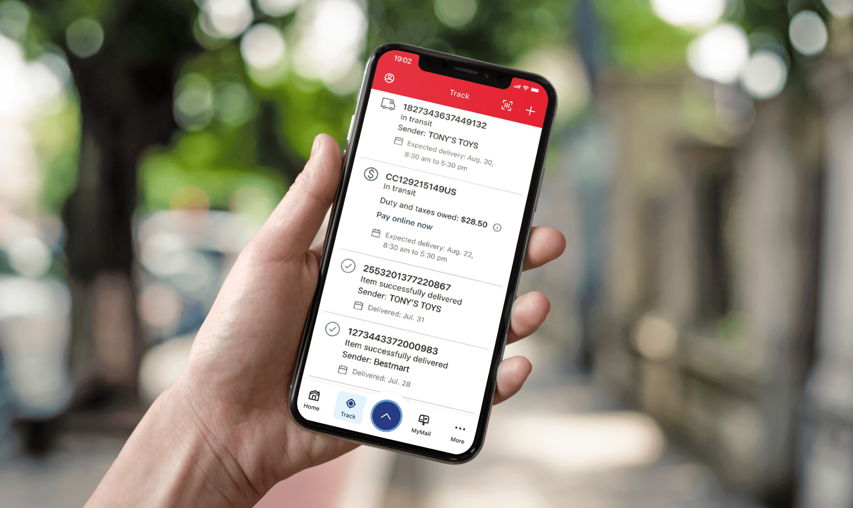 A cell phone screen displays the Track screen of the Canada Post app with a list of incoming and delivered items.