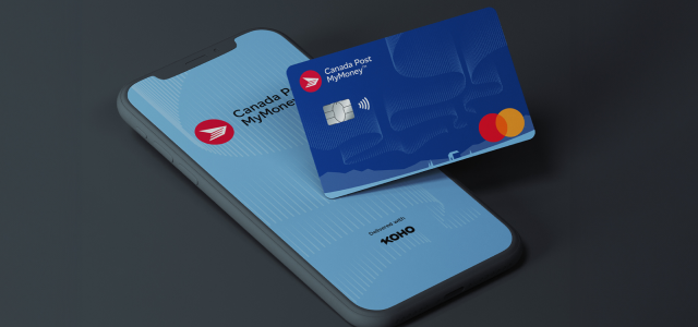 The Canada Post MyMoney card sits on a smartphone screen. The screen says “Canada Post MyMoney, delivered with KOHO”.