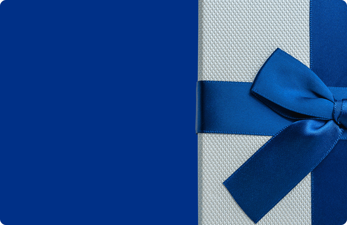 A white gift box wrapped in a blue ribbon.
