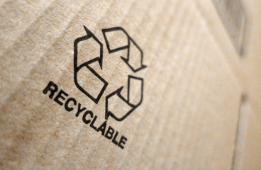 A corrugated shipping box features a “recyclable” stamp.