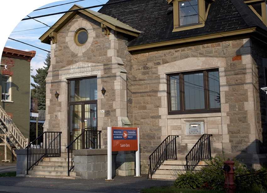 It is day time outside a Canada Post post office in Saint-Ours, Quebec.