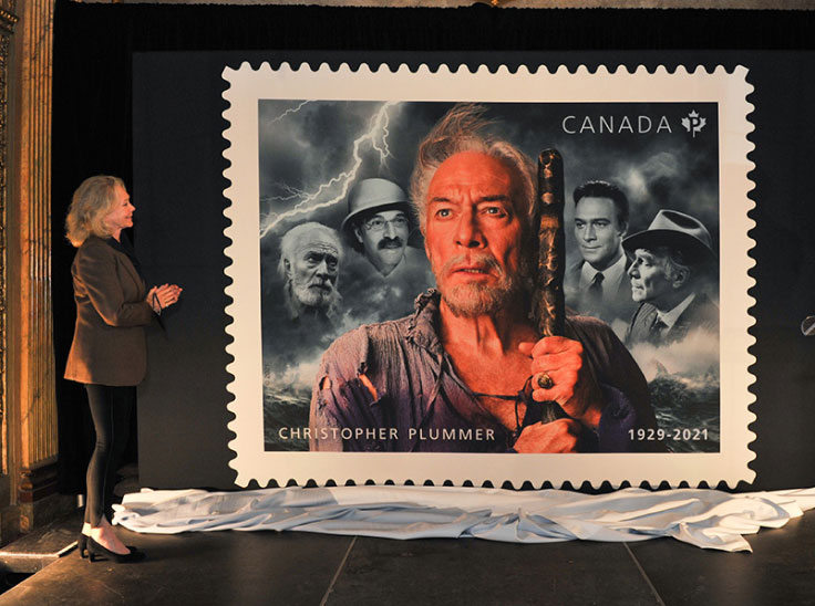 Elaine Taylor Plummer unveils a stamp honouring her late husband, Christopher Plummer, at Toronto’s Elgin and Winter Garden Theatre Centre.