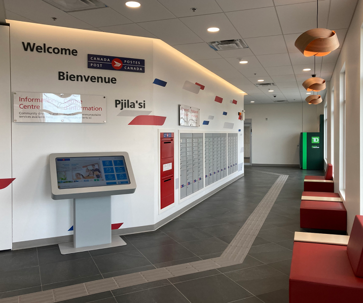 The interior of Canada Post's new Membertou community hub includes a grid of parcel lockers and a self-serve station.