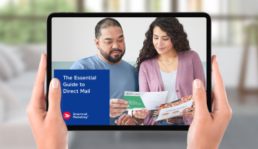 Close up of hands holding a tablet featuring Canada Post’s Essential Guide to Direct Mail