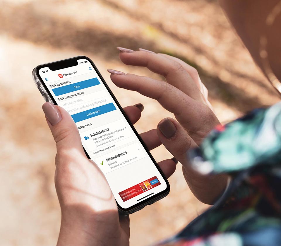 Woman using the Canada Post mobile app