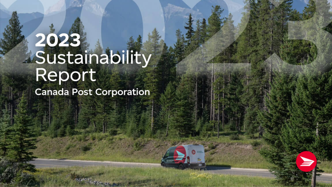 A Canada Post delivery van drives along a rural road lined with dense forest. The Rocky Mountains are in the distance. 