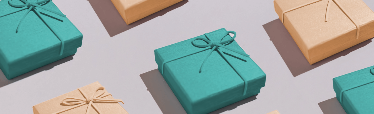 Several gift boxes in yellow and green wrapping paper are arranged in rows.