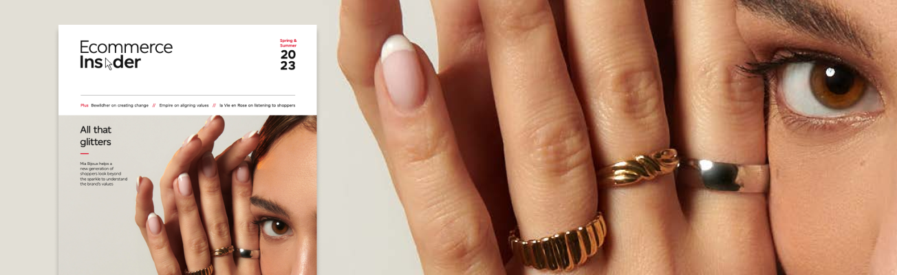 The cover of the spring/summer 2023 edition of “Ecommerce Insider” magazine features a woman wearing rings. The magazine cover is overlayed on a closeup of the same woman wearing rings.